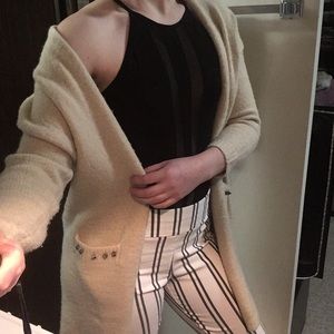 Cardigan- cream colored with spiked pockets